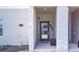 Modern townhome entry with green door and brick accents at 1138 Kingsbarn St, Davenport, FL 33896