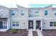 Two-story townhome with modern facade and landscaping at 1138 Kingsbarn St, Davenport, FL 33896