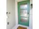 Modern front door with glass panels and welcome mat at 1138 Kingsbarn St, Davenport, FL 33896