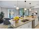 Modern kitchen with large island and breakfast bar at 1138 Kingsbarn St, Davenport, FL 33896