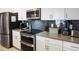 Modern kitchen with stainless steel appliances at 1138 Kingsbarn St, Davenport, FL 33896
