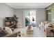 Living room with pool view and modern furniture at 1138 Kingsbarn St, Davenport, FL 33896