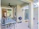 Covered patio with dining table, grill, and access to the pool at 1138 Kingsbarn St, Davenport, FL 33896