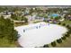 Aerial view of a community sand volleyball court with surrounding resort amenities at 1138 Kingsbarn St, Davenport, FL 33896
