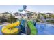 Aerial view of a community waterpark with slides and play features at 1138 Kingsbarn St, Davenport, FL 33896