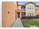 Exterior view of condo building with walkway and landscaping at 12311 Lantana Park Ln # 108, Orlando, FL 32837