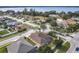 Aerial view of a lakefront community with single-Gathering homes and lush landscaping at 125 Viola Dr, Auburndale, FL 33823