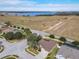 Aerial view showing house, neighborhood, and lake at 125 Viola Dr, Auburndale, FL 33823