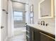 Clean bathroom with a modern vanity, tub and shower combo at 125 Viola Dr, Auburndale, FL 33823