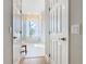 Luxurious bathroom with soaking tub, walk-in shower, and marble floors at 125 Viola Dr, Auburndale, FL 33823
