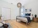 Bright bedroom with wood floors, a double door closet, and a cozy atmosphere at 125 Viola Dr, Auburndale, FL 33823