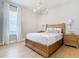 Bright bedroom featuring a wooden bed frame and ample natural light at 125 Viola Dr, Auburndale, FL 33823