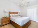 Comfortable bedroom with a wooden bed frame and built-in closet at 125 Viola Dr, Auburndale, FL 33823