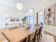 Dining room with a large wooden table, light walls, and hardwood floors at 125 Viola Dr, Auburndale, FL 33823