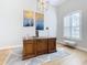 Home office with large wooden desk, light walls, and hardwood floors at 125 Viola Dr, Auburndale, FL 33823
