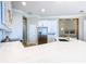 Bright kitchen showcasing white cabinets and quartz countertops at 125 Viola Dr, Auburndale, FL 33823