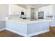 Modern kitchen with white cabinets and a large island at 125 Viola Dr, Auburndale, FL 33823