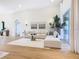 Light and airy living room with sectional sofa and access to patio at 125 Viola Dr, Auburndale, FL 33823