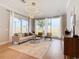Spacious living room with large windows and light flooring at 125 Viola Dr, Auburndale, FL 33823