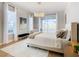 Spacious main bedroom with plush bed, sitting area, and access to backyard at 125 Viola Dr, Auburndale, FL 33823