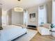 Main bedroom features a large bed, sitting area, and stylish decor at 125 Viola Dr, Auburndale, FL 33823