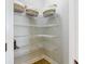 Walk-in pantry with ample shelving for storage at 125 Viola Dr, Auburndale, FL 33823