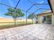 Large screened patio area with view of the backyard at 125 Viola Dr, Auburndale, FL 33823