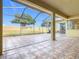 Spacious screened patio with tiled floor and view of backyard at 125 Viola Dr, Auburndale, FL 33823