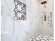 Spa-like shower with marble walls and rainfall shower head at 125 Viola Dr, Auburndale, FL 33823