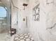 Large walk-in shower with marble tile and glass enclosure at 125 Viola Dr, Auburndale, FL 33823