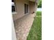 A tiled back patio, accessible via sliding glass doors, offers seamless indoor-outdoor living at 149 Birmingham Dr, Kissimmee, FL 34758