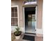 Welcoming entryway with neutral colors, ceramic tile floors, and a view of the backyard through sliding glass doors at 149 Birmingham Dr, Kissimmee, FL 34758