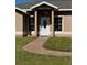 One-story home with a paved walkway leading to the front entrance at 149 Birmingham Dr, Kissimmee, FL 34758