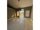 Bright and airy living room with tile flooring and an open door to the outdoors at 149 Birmingham Dr, Kissimmee, FL 34758