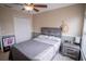 Cozy bedroom with a queen-size bed and ceiling fan at 16526 Cedar Crest Dr, Orlando, FL 32828