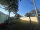 Large backyard with a shed and privacy fence at 1928 Beechwood Dr, Lakeland, FL 33803