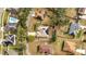 Aerial view showing home and neighborhood with solar panels at 203 North Cir, Davenport, FL 33837