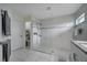 Walk-in shower with glass enclosure and marble-style tile at 203 North Cir, Davenport, FL 33837