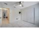 Bedroom with double door closet and tile flooring at 203 North Cir, Davenport, FL 33837