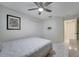 Bright bedroom with double doors and ceiling fan at 203 North Cir, Davenport, FL 33837