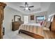Main bedroom with a wooden bed frame and dresser at 203 North Cir, Davenport, FL 33837