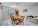 Dining room with wooden table and corner hutch at 203 North Cir, Davenport, FL 33837