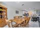 Country style dining room with wooden table and hutch at 203 North Cir, Davenport, FL 33837