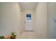 Bright entryway with white walls and a tile floor at 203 North Cir, Davenport, FL 33837