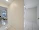 Hallway with tile flooring and access to bedrooms at 203 North Cir, Davenport, FL 33837