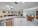 Open concept kitchen with granite island, stainless steel appliances, and breakfast area at 203 North Cir, Davenport, FL 33837