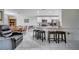Kitchen with granite counters and breakfast bar at 203 North Cir, Davenport, FL 33837
