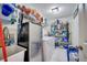 Bright and spacious laundry room with shelving and a utility sink at 203 North Cir, Davenport, FL 33837