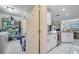 Laundry room with washer, dryer, and ample storage shelving at 203 North Cir, Davenport, FL 33837
