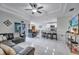 Open living area with sectional sofa and kitchen access at 203 North Cir, Davenport, FL 33837